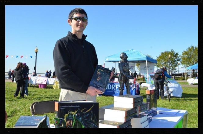 AJ signing and selling copies of The Silver Talon to support the JDRF